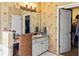 Traditional bathroom featuring a vanity with seating and generous storage along with access to a large closet at 5105 Riverthur Pl, Duluth, GA 30096