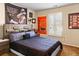 Bedroom featuring sports memorabilia, window with plantation shutters, and a comfy bed at 5105 Riverthur Pl, Duluth, GA 30096