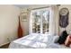 Light filled bedroom with calming decor, large window, and a view of trees at 5105 Riverthur Pl, Duluth, GA 30096