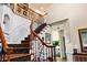 Elegant foyer featuring paneled walls, and a staircase with wrought iron at 5105 Riverthur Pl, Duluth, GA 30096