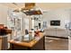 Spacious kitchen featuring a center island with cooktop, and views to the living room at 5105 Riverthur Pl, Duluth, GA 30096