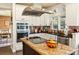 Bright kitchen featuring stainless steel appliances, granite countertops, and custom white cabinetry at 5105 Riverthur Pl, Duluth, GA 30096