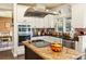 Gourmet kitchen boasts stainless steel appliances, granite countertops, and ample cabinet space at 5105 Riverthur Pl, Duluth, GA 30096
