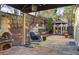 Relaxing backyard with stone patio, fireplace, gazebo, and hanging chair at 5105 Riverthur Pl, Duluth, GA 30096