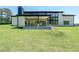 Expansive backyard showcasing covered patio and modern home architecture at 972 Auburn Rd, Dacula, GA 30019