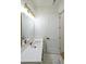 Stylish bathroom with a gold-framed mirror, modern lighting, marble counters, and black hardware at 972 Auburn Rd, Dacula, GA 30019