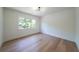 Bright bedroom with large window and wood floors, offering a serene and inviting atmosphere at 972 Auburn Rd, Dacula, GA 30019