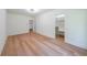 Bright bedroom with light hardwood floors and walk-in closets at 972 Auburn Rd, Dacula, GA 30019