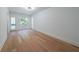 Minimalist bedroom with light hardwood floors and neutral walls, creating a serene atmosphere at 972 Auburn Rd, Dacula, GA 30019