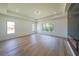 Spacious bedroom with tray ceilings, a fireplace, and multiple windows at 972 Auburn Rd, Dacula, GA 30019