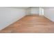 Finished bonus room with hardwood floors and custom built-in shelving at 972 Auburn Rd, Dacula, GA 30019