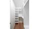 Walk-in closet featuring custom shelving and storage solutions at 972 Auburn Rd, Dacula, GA 30019