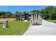 Attractive home with manicured lawn, modern design, and elegant brick mailbox and entry features at 972 Auburn Rd, Dacula, GA 30019