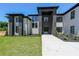 Elegant new build with a stylish black and white brick exterior and professionally landscaped front yard at 972 Auburn Rd, Dacula, GA 30019