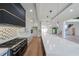 Gourmet kitchen with an oversized island, stainless steel appliances and custom backsplash at 972 Auburn Rd, Dacula, GA 30019