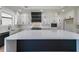 Modern kitchen with white cabinets, a large island, and stainless steel appliances at 972 Auburn Rd, Dacula, GA 30019