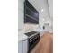 Close up of a gourmet kitchen with stainless steel appliances and designer range hood at 972 Auburn Rd, Dacula, GA 30019