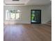 Bright and airy living area with a large window and sliding glass door for natural light and backyard access at 972 Auburn Rd, Dacula, GA 30019