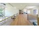Bright living room boasts an open layout, modern railing, recessed lighting, and a decorative hanging chandelier at 972 Auburn Rd, Dacula, GA 30019