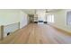 Spacious living room features an open layout, fireplace, hardwood floors, and big windows offering plenty of natural light at 972 Auburn Rd, Dacula, GA 30019