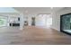 Expansive living area with hardwood floors flowing into a modern kitchen and dining space at 972 Auburn Rd, Dacula, GA 30019