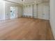 Main bedroom with an open layout boasts a luxurious bathroom and custom shelving, offering ample storage space at 972 Auburn Rd, Dacula, GA 30019