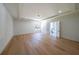 Spacious main bedroom with hardwood floors, tray ceiling, and an ensuite bathroom offers a private retreat at 972 Auburn Rd, Dacula, GA 30019
