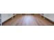 Walk-in closet features white shelving and hardwood floors at 972 Auburn Rd, Dacula, GA 30019