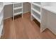 An expansive walk-in closet complete with custom shelving, providing a large, organized storage area at 972 Auburn Rd, Dacula, GA 30019