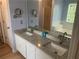 Bathroom features double sinks, granite countertops, and a tub at 1075 Crystal Water Dr, Lawrenceville, GA 30045