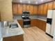 Features granite countertops, wooden cabinets, and stainless steel appliances at 1075 Crystal Water Dr, Lawrenceville, GA 30045
