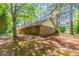 Brick home exterior with beautiful landscaping and mature shade trees at 1296 Carman Se Ct, Conyers, GA 30013