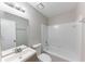 Bathroom with white tile shower and modern vanity at 1296 Carman Se Ct, Conyers, GA 30013