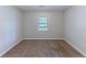 Bedroom with a neutral carpet and a window that provides natural light at 1296 Carman Se Ct, Conyers, GA 30013