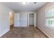 Bedroom with neutral carpet, a window and a closet with bi-fold doors at 1296 Carman Se Ct, Conyers, GA 30013