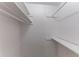 This is a closet with white walls and shelves at 1296 Carman Se Ct, Conyers, GA 30013