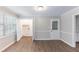 Eat-in kitchen features white cabinets and a door to the backyard at 1296 Carman Se Ct, Conyers, GA 30013