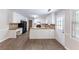Kitchen with white cabinets, butcher block counters and black appliances at 1296 Carman Se Ct, Conyers, GA 30013