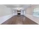 Spacious living room with a brick fireplace, built-in shelving, and wood-look floors at 1296 Carman Se Ct, Conyers, GA 30013