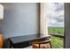 Bedroom featuring a wooden desk with a view of the cityscape beyond the trees at 145 15Th Ne St # 1225, Atlanta, GA 30309