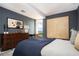 Bedroom featuring modern decor, a large painting, and scenic views from the window at 145 15Th Ne St # 1225, Atlanta, GA 30309