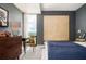 Bedroom with stylish decor including a large painting, dresser, and window views at 145 15Th Ne St # 1225, Atlanta, GA 30309