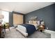 Stylish bedroom featuring a large bed, accent wall, and expansive window with scenic views at 145 15Th Ne St # 1225, Atlanta, GA 30309