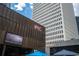 Impressive commercial building featuring modern architecture, prominent signage, and vibrant outdoor umbrellas at 145 15Th Ne St # 1225, Atlanta, GA 30309