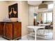 Chic dining area featuring modern decor, a mirror that reflects an adjacent living room, and ample natural light at 145 15Th Ne St # 1225, Atlanta, GA 30309