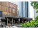 Stunning exterior view of a multi-story commercial building featuring modern design and a lively entertainment complex at 145 15Th Ne St # 1225, Atlanta, GA 30309