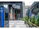 Exterior view of entrance to Colony Square with outdoor artwork and pedestrian walkway at 145 15Th Ne St # 1225, Atlanta, GA 30309