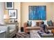 Bright living room featuring modern art, comfortable seating, and decorative items on the coffee table at 145 15Th Ne St # 1225, Atlanta, GA 30309