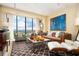 Bright living room features a large window with a stunning view and stylish, comfortable seating at 145 15Th Ne St # 1225, Atlanta, GA 30309