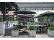 Comfortable outdoor seating with umbrellas and plants offer a place to relax at 145 15Th Ne St # 1225, Atlanta, GA 30309